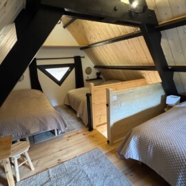 Location chalet Lac de Payolle : lits installés sur la mezzanine.